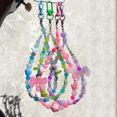 آویز گوشی و اکسسوری فانتزی دور دستی (همراه با طلق پلاستیکی داخل کیس)