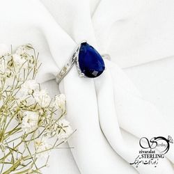 انگشتر نقره نگین اشکی سرمه ای (طرح یاقوت کبود) کد 17315