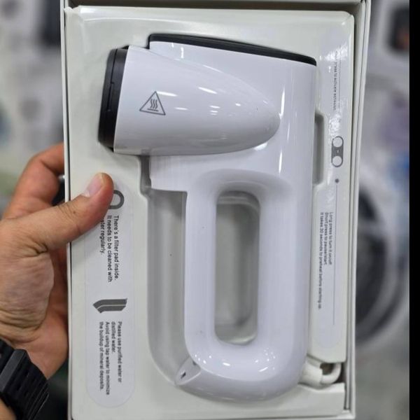 دستگاه اتو بخار مکشی (Aspirating Steamer / Suction-Type Ironing Machine
