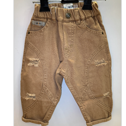 شلوار جین کرم زاپدار