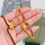 دستبند طلا با نخ ابریشمی طرح دسته گل