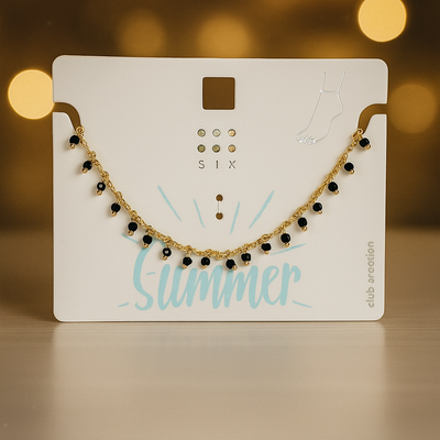 پابند ظریف طلایی با آویزهای مروارید مشکی براق