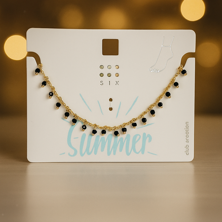 پابند ظریف طلایی با آویزهای مروارید مشکی براق