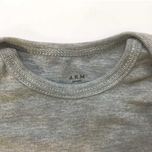 بادی بدون آستین نوزادی آرم پوش مدل یقه باز شونده