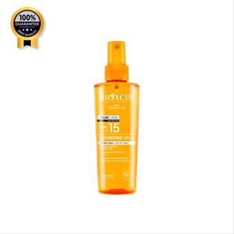 روغن برنز کننده بیوکسین Bioxcin اورجینال حاوی کره کاکائو و روغن هویج و ویتامین E با Spf15 حجم 200 میل