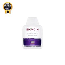 شامپو ضد ریزش سیر سیاه بیوکسین Bioxcin اورجینال مناسب مو ضعیف و شکننده حجم 300 میل